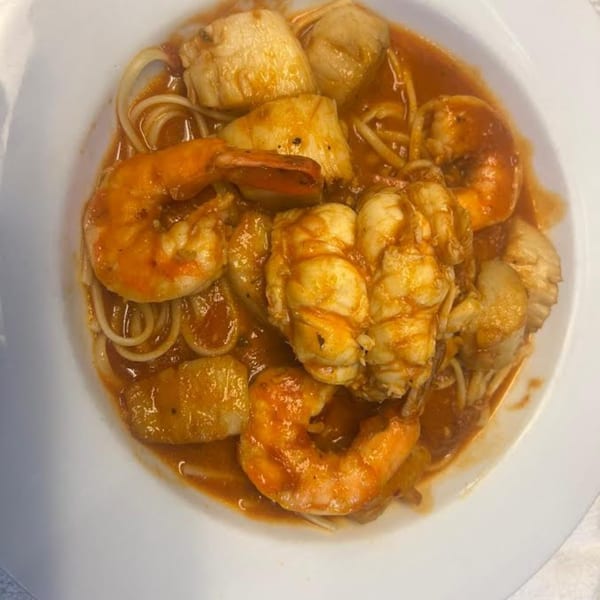 Monalisia's seafood pasta with shrimp, scallops, and lobster in a rich red sauce.